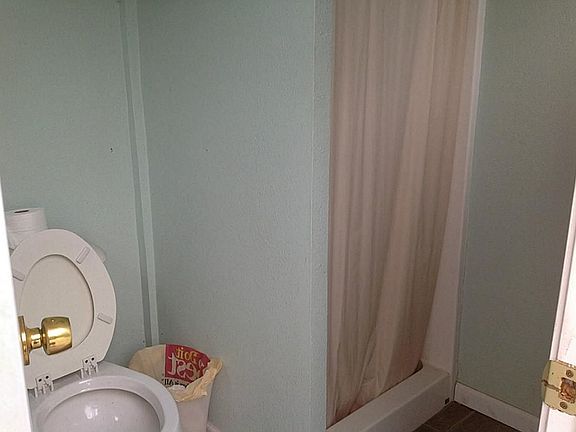 Bathroom comes with a toilet and shower.