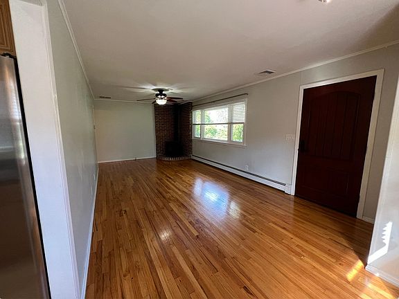 Living/Dining room with decorative wood stove