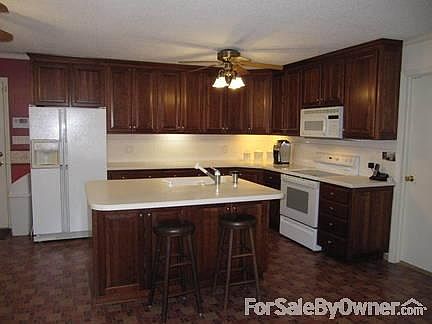 Updated Kitchen
						:
						Kitchen solid cherry cabinets, solid surface tops