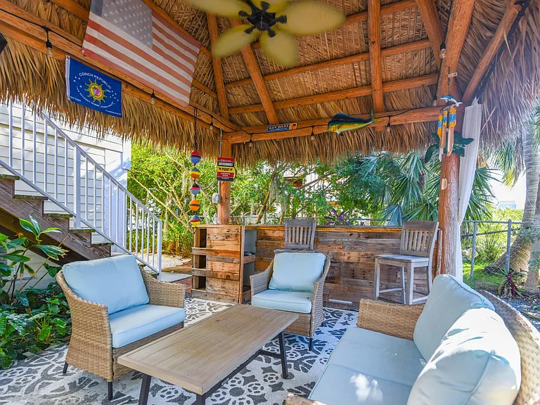 Covered patio area with outdoor seating