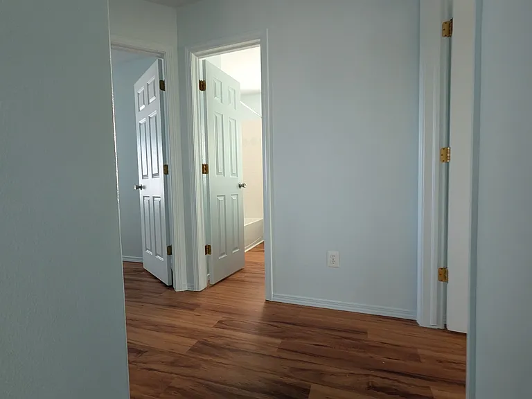 upstairs with 3 bedrooms and 2 bathrooms