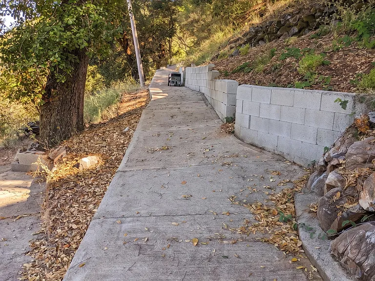 Part of the .15 mile loop that you can acces any time from your front door. Note bench, cut from property Redwood, for what we call "Meditation Point." If you are an early riser, a short walk with your coffee allows you to see the sunrise.