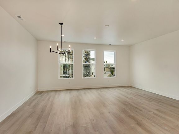 Empty living and dining rooms in a sego home