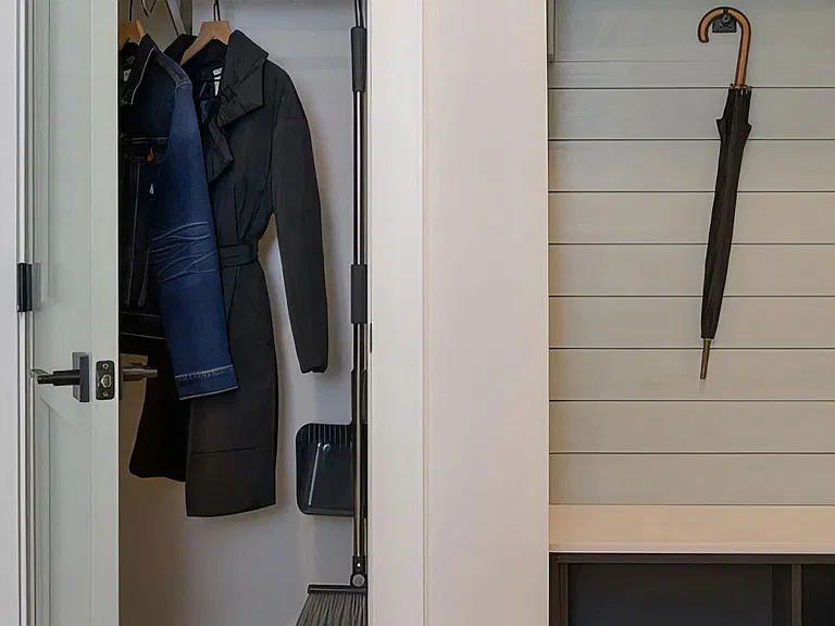 Cozy entryway foyer with hall closet and coat hooks