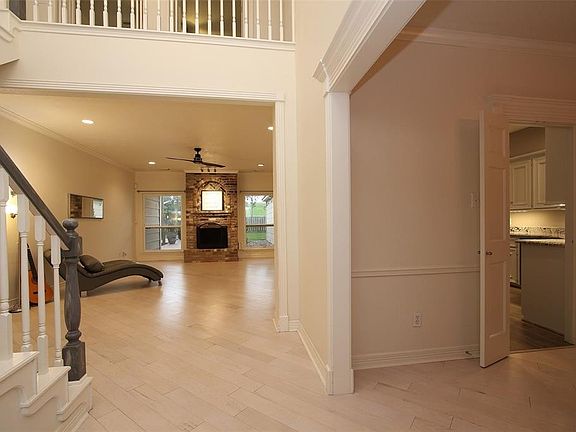Your two-story entry opens on the right to the Dining Room, and your Living Room is straight ahead. Notice the flow from the Dining Room to the Kitchen and Living Room, and the beautiful view from your Living Room.