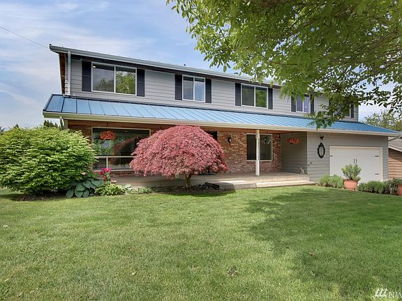 Covered front porch & metal roof.