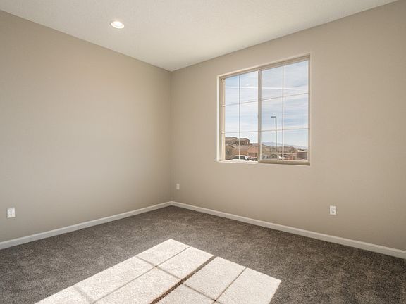 To the right of the entryway, you will find a bedroom perfect for housing guests.