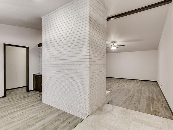 View from front door. Living room on right, dining on left