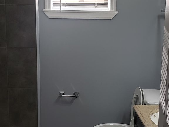 Bathroom new tile bathtub and floor tile.