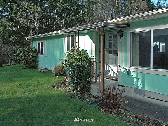 This unit is on the edge of the complex looking into a green belt!