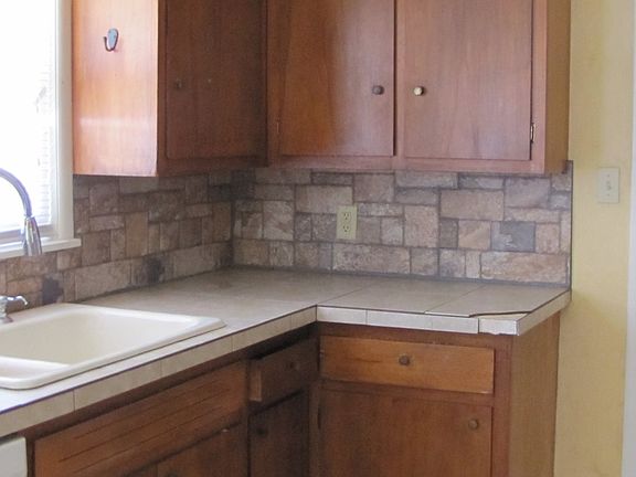 even showing the kitchen sink with new faucet