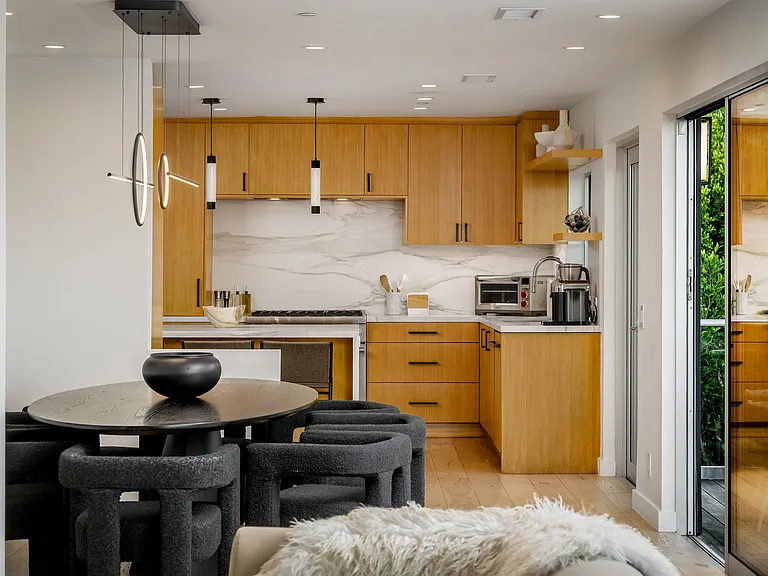 A fully outfitted chef's kitchen with high-end appliances, 3 counter stools, Nespresso and Breville coffee makers, plus complete dinnerware, flatware, drinkware, and bakeware_designed for effortless cooking and entertaining.