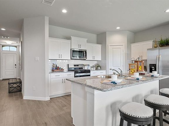 Kitchen - All Home and community information, including pricing, included features, terms, availability and amenities, are subject to change at any time without notice or obligation. All Drawings, pictures, photographs, video, square footages, floor plans, elevations, features, colors and sizes are approximate for illustration purposes only and will vary from the homes as built.