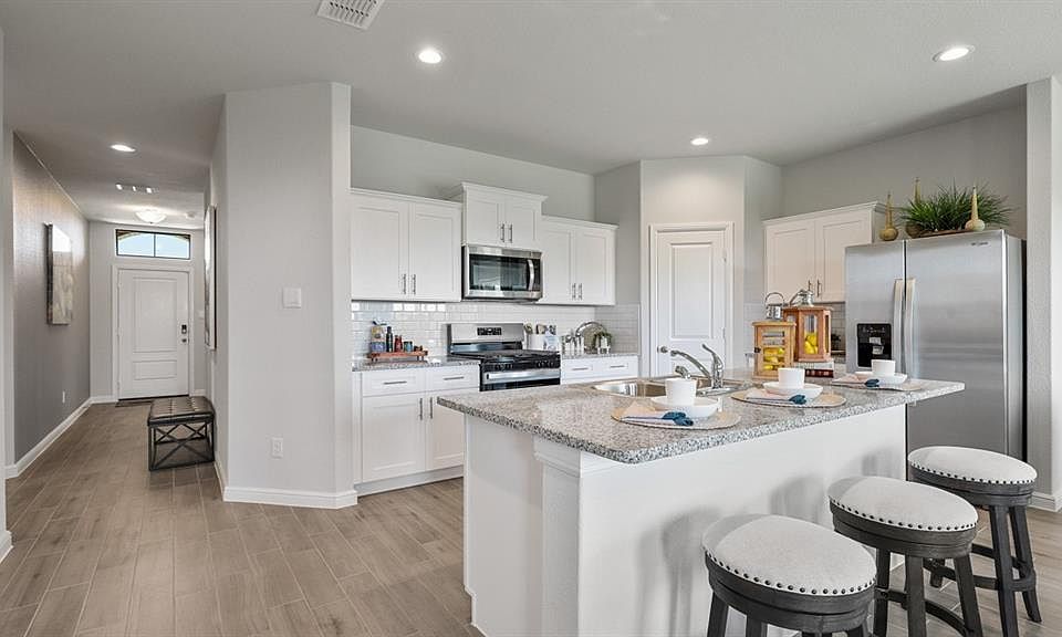 Kitchen - All Home and community information, including pricing, included features, terms, availability and amenities, are subject to change at any time without notice or obligation. All Drawings, pictures, photographs, video, square footages, floor plans, elevations, features, colors and sizes are approximate for illustration purposes only and will vary from the homes as built.