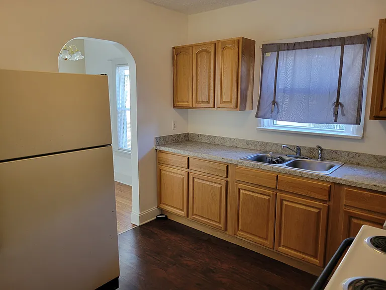 Kitchen leading to breakfast nook and new window.