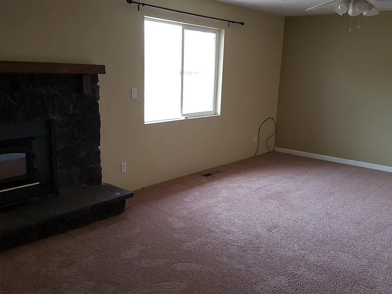 master bedroom with wood burning stove