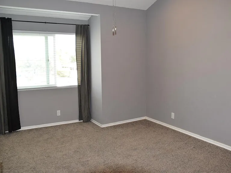 Bedroom 3 from doorway. closet has doors and is on the left.