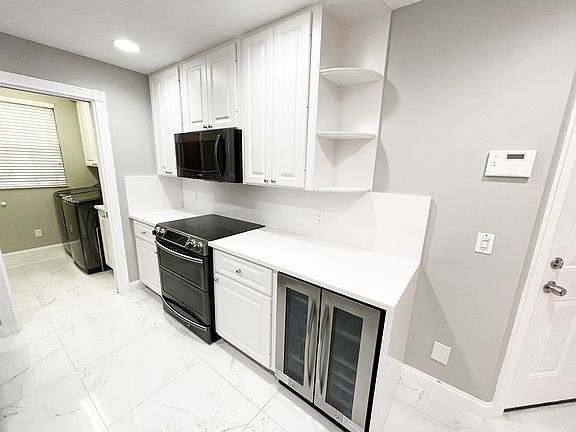 Winebar fridge to Garage entry