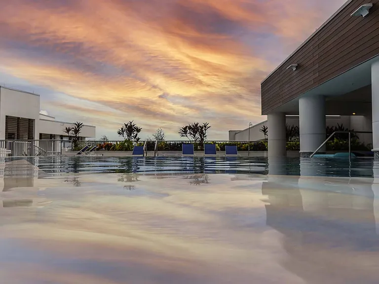 End your day with a swim at sunset, where the sky meets the water for the perfect moment of calm.