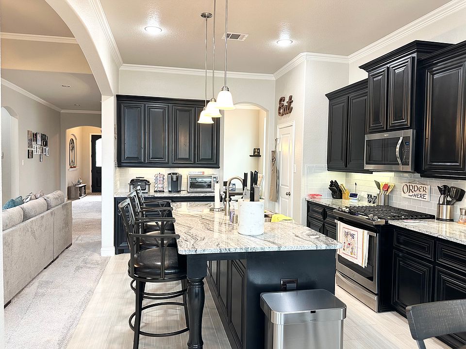 Modern Kitchen with granite countertops, oversized island, SS Appliances, and 42inch handcrafted cabinets for plenty of storage
