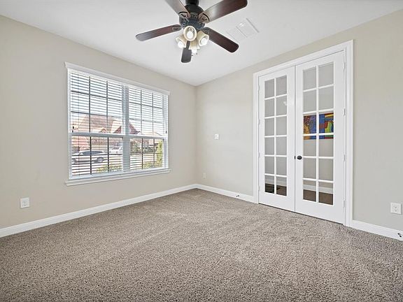 Spacious Study Room with new carpet and 8ft French Doors.