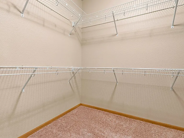 Elevate your organization with the spacious walk-in closet at Northdale Apartments. Perfectly designed for your storage needs, this room offers ample space for all your essentials. Don't miss outschedule a tour today!