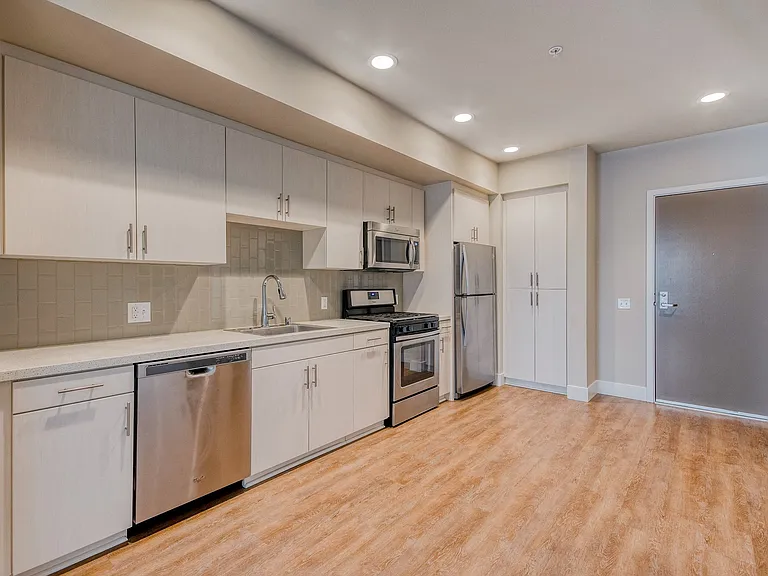 Stunning kitchens feature quartz countertops and tike backsplash