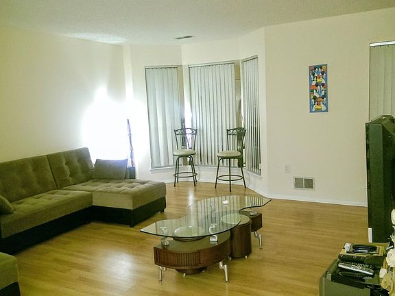 Large living room with bay window, coat closet and large walk-in closet to provide ample storage.