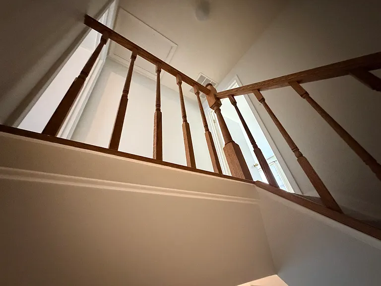 Staircase leading to 2 second level en suite bedrooms.