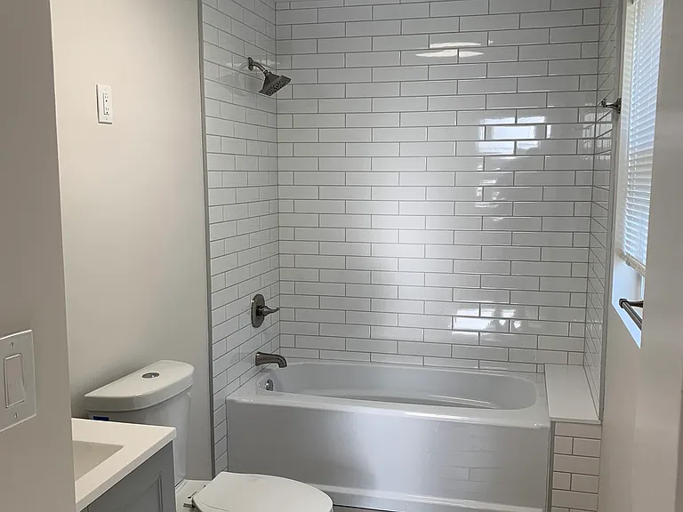 Custom tile shower with rainfall shower head