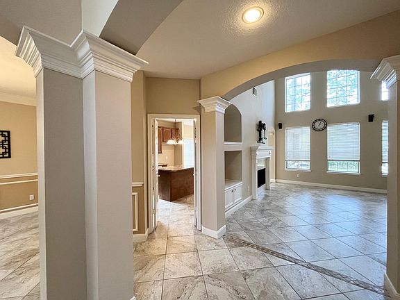 Foyer looking into kitchen through the double doors