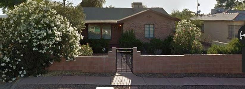 Front of house; gated, enclosed front yard; covered porch