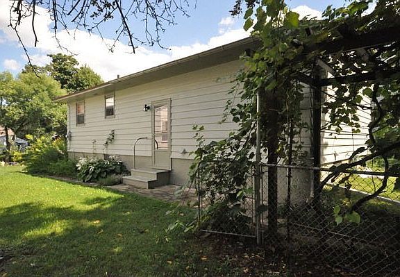 Side entry and grape arbor.