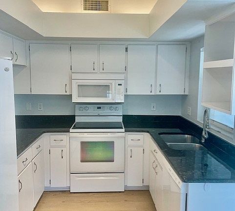Kitchen with sliding glass door to small back patio