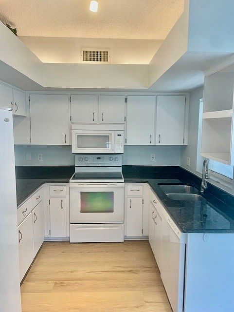 Kitchen with sliding glass door to small back patio