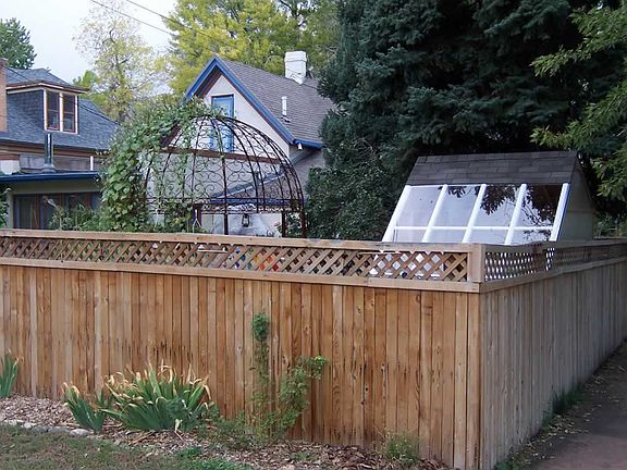 Street view of the back garden showing the gazebo and the solar greenhouse.
