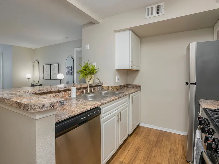 Delight in a spacious breakfast bar uniting the kitchen and living area offering open-concept living to keep conversations flowing.