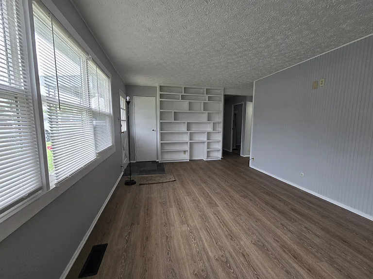 Spacious Living Room with Built-in Shelving