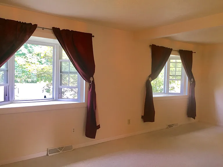 upstairs master bedroom with bay windows unfurnished