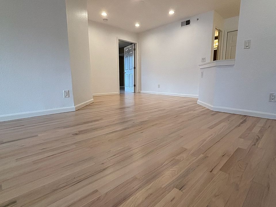 entrance - view of living space, entrance to kitchen and second bedroom