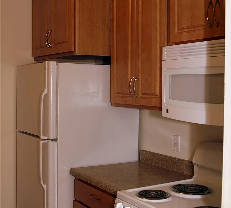 Large refrigerator. Extra tall cabinets. Microwave above ran