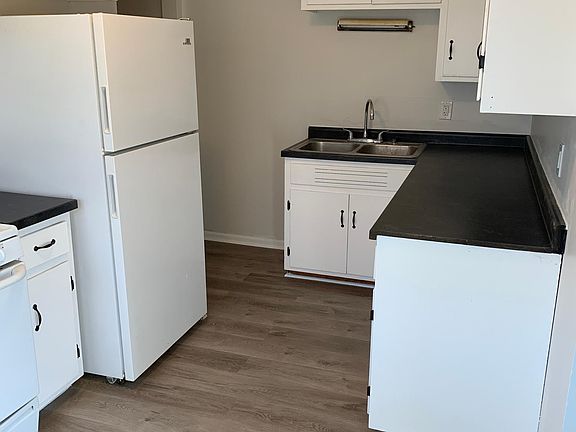 Kitchen view of remodeled cabinets and countertops.