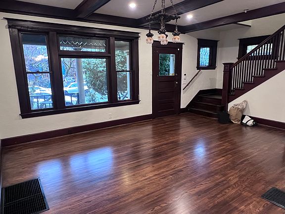 Living room with stairs going up to the second floor
