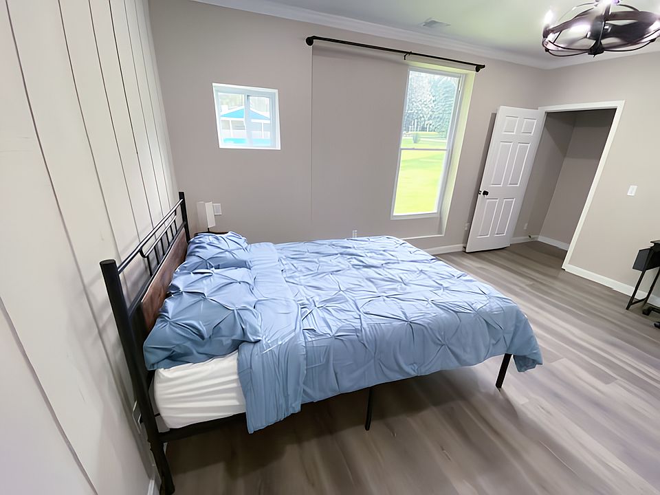 Orange room - extra large room with large walk-in closet. Very spacious with chandelier with fan, desk, stool