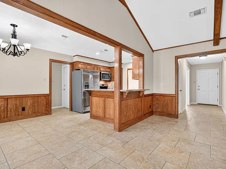 Foyer into large family room, eat in kitchen area