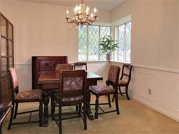 Formal dining with chair rail.