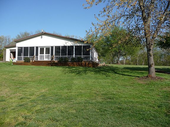 screened porch of guest hous