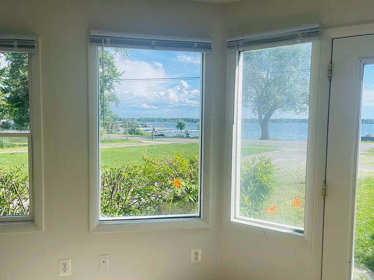 This is the front view. Look at it! Those flowers? The bushes? The tree with the lake in the background? Couldn't ask for a better view.