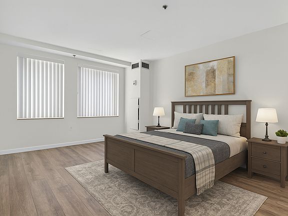 Primary bedroom staged, flooring to be replaced