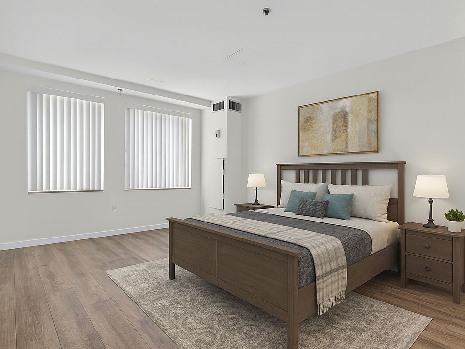 Primary bedroom staged, flooring to be replaced